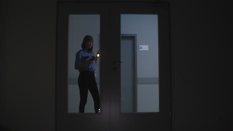 woman in uniform searching on the hallway