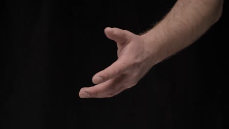 male hands on a black background