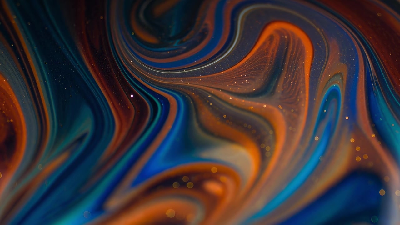 Colori vorticosi astratti e particelle scintillanti nel liquido