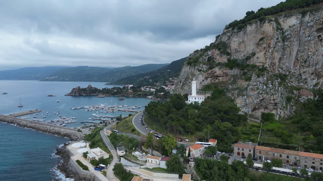 Aerial drone footage of Cefalù, Sicily: historic town, crystal sea, sandy beach and the iconic Rocca. Perfect for travel, landscape and Mediterranean stock footage
