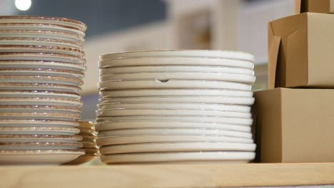 stack of plates on a wooden table