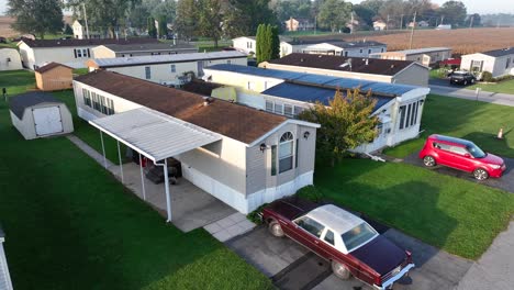 Antique-car-outside-of-a-mobile-home-in-a-rural-trailer-park-in-USA