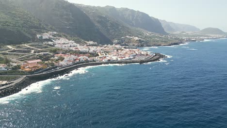 drone push in to reveal quaint ocean view town near port garachico tenerife spain