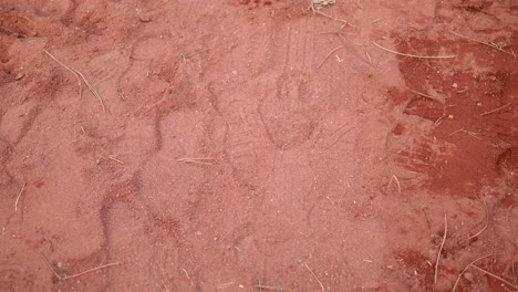 red sand ground texture with footprints