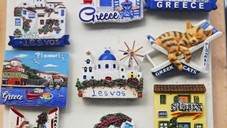 a greek souvenir shop in lesvos, with a variety of local magnets.