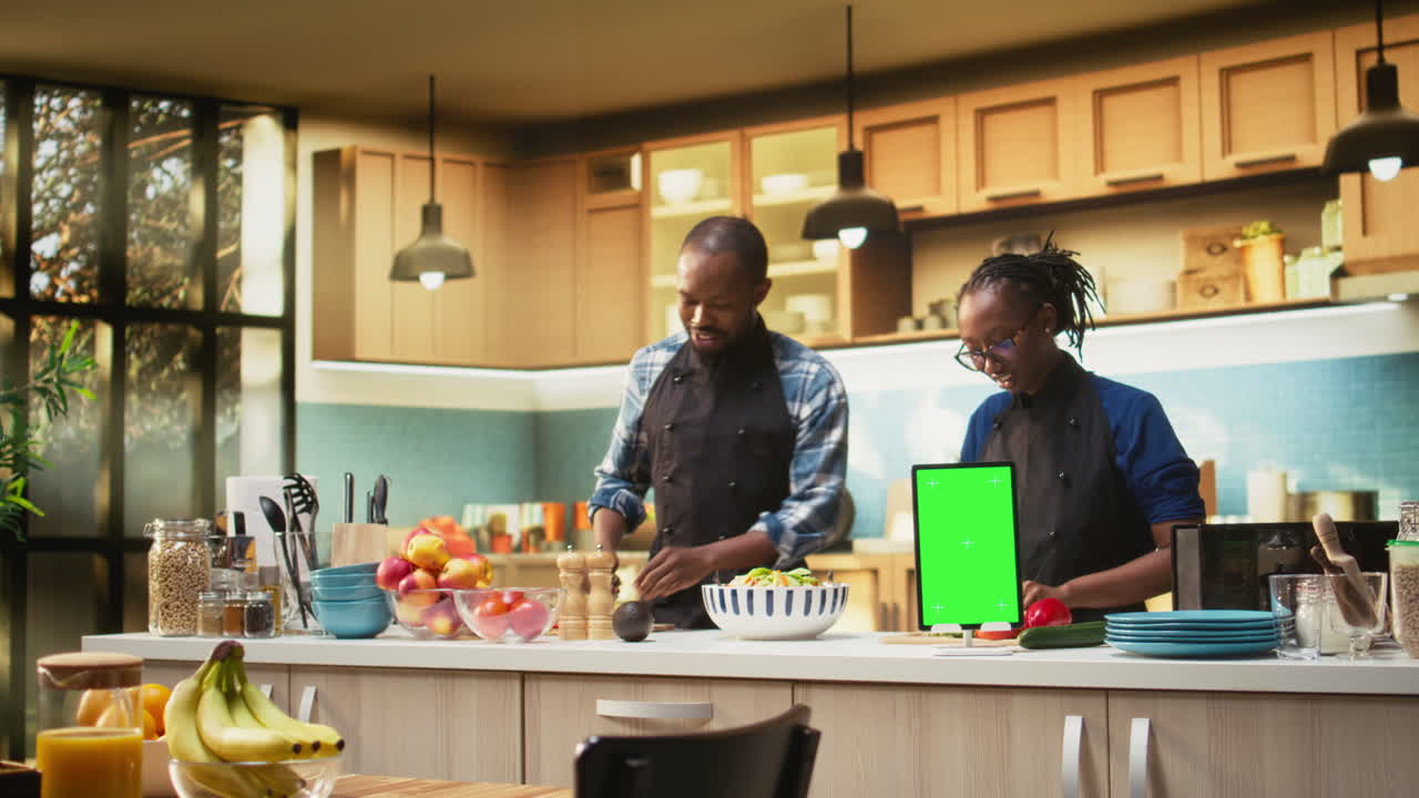 People cooking in a kitchen with fresh ingredients