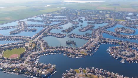 view from above of waterfront community houses built on man-made dikes