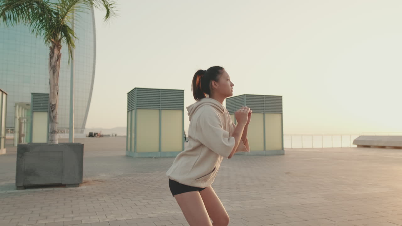 Woman Exercising Outdoors in Urban Setting