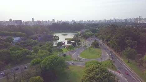 panning aerial shot of ibirapuera park and center of sao paolo near avenida paulista in brazil