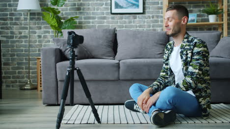 man vlogging at home