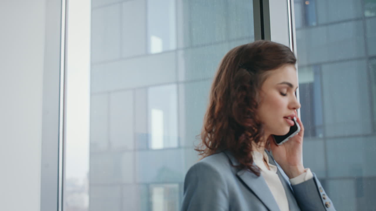 Girl business manager calling client noting information in notepad close up.