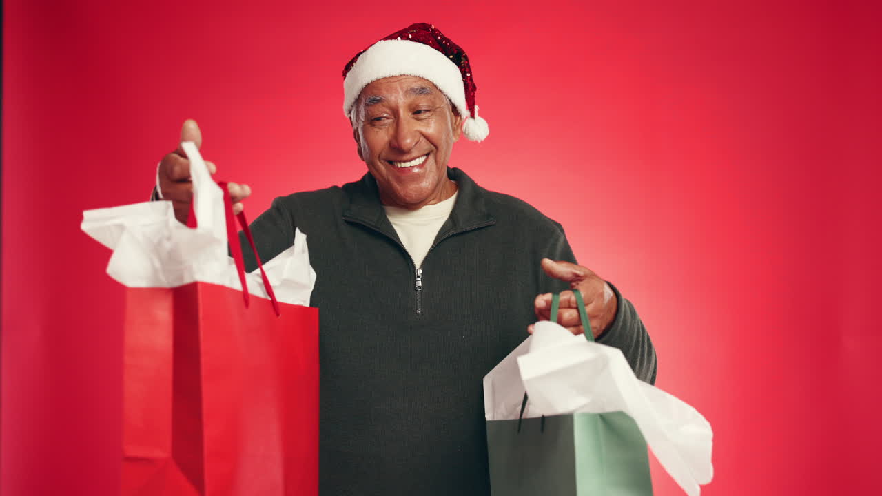 Man with Shopping Bags and Santa Hat