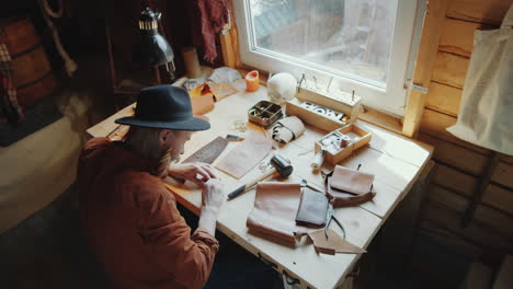 craftsman working in leather workshop