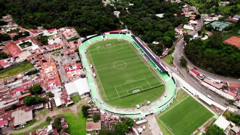 aerial footage of football stadium and the city of guatemala