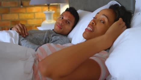 couple arguing on bed in bedroom 4k