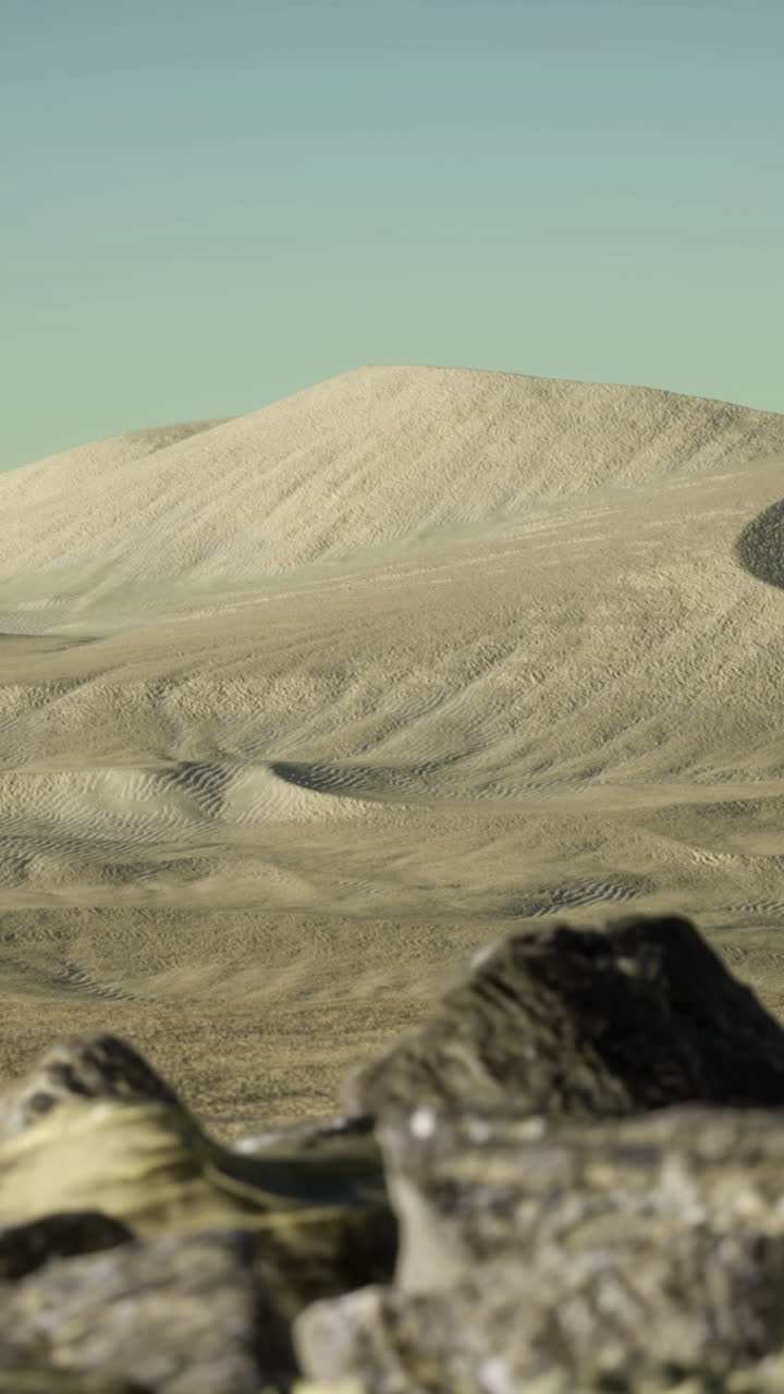 Endless dunes and rugged stones in a vast desert landscape at twilight