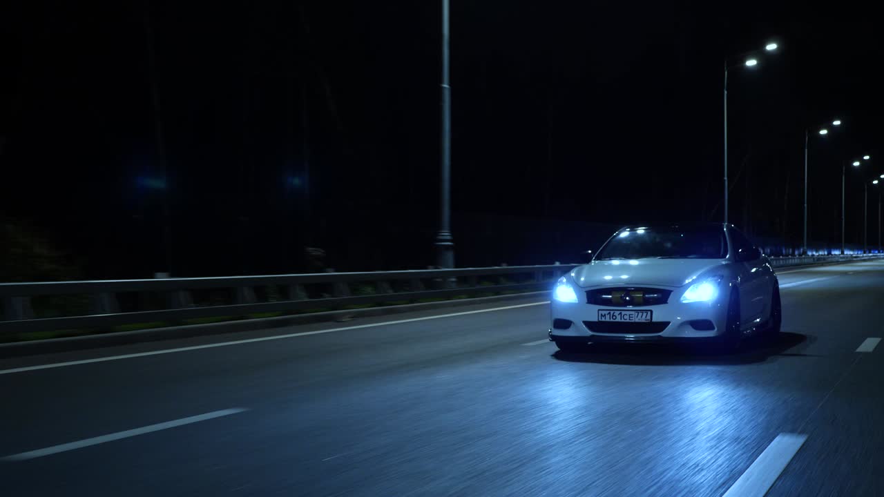 Cars driving on the highway at night