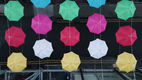 Aerial-top-shot-of-colorful-Umbrella-street-during-a-cold-day-in-January-in-Dublin,-Ireland