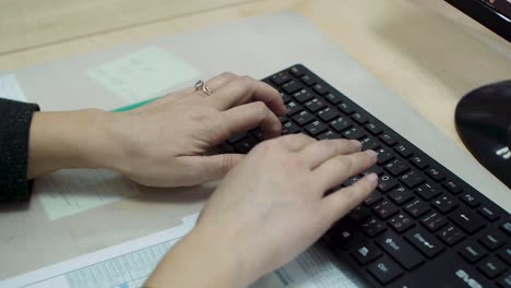 person typing on a keyboard