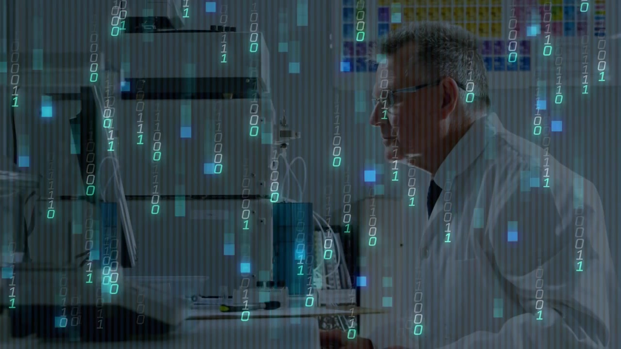 Senior scientist reaching sample vial inserting into analyzer viewing dynamic graphics for analysis