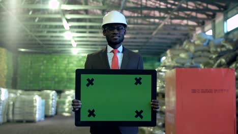 smiling businessman with chromakey sign