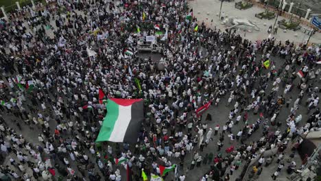 aerial view, street action or demonstrators supporting palestinians for freedom and also palestinian donations in the center of yogyakarta city, zero kilometers.