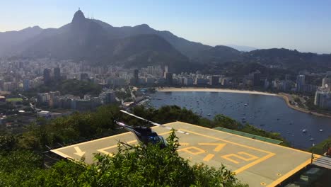 A-helicopter-taking-off-from-a-landing-pad-from-Sugar-Loaf-in-Rio-de-Janeiro-,-Brazil