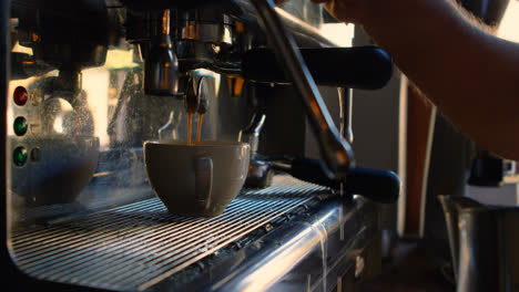 male chef using coffeemaker in bakery shop 4k