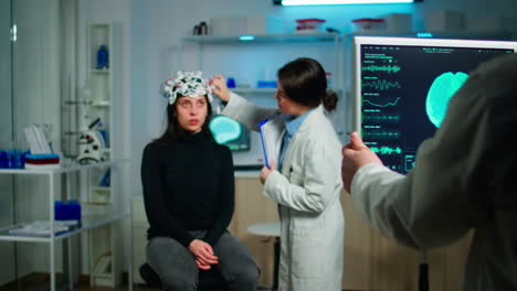 stressed patient sitting on neurological chair with eeg headset