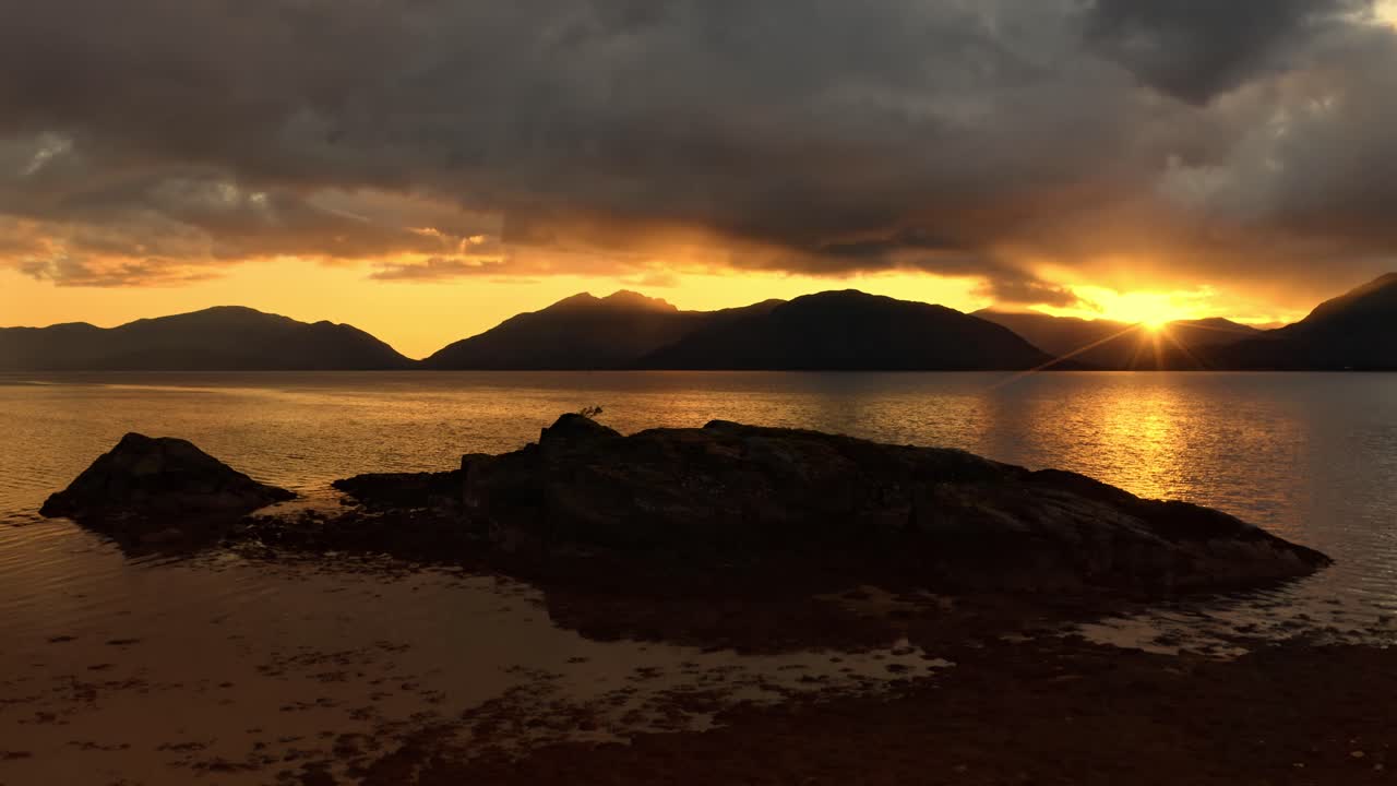 Drone footage of a stormy sunset over Loch Linnhe, from North Ballachulish, Fort William, Scotland