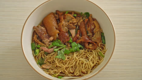 stewed pork leg noodles in brown soup