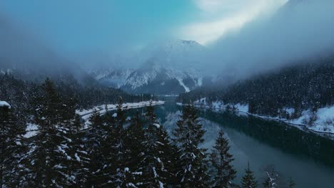 lake plansee in austria in winter with snow