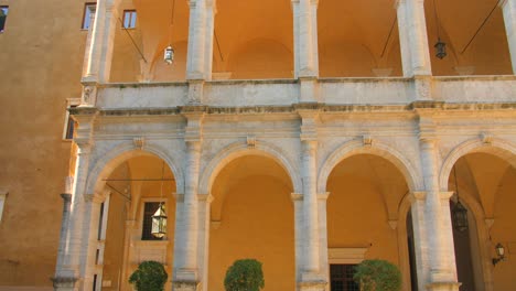 view of archs of palazzo venezia in rome, italy - wide shot