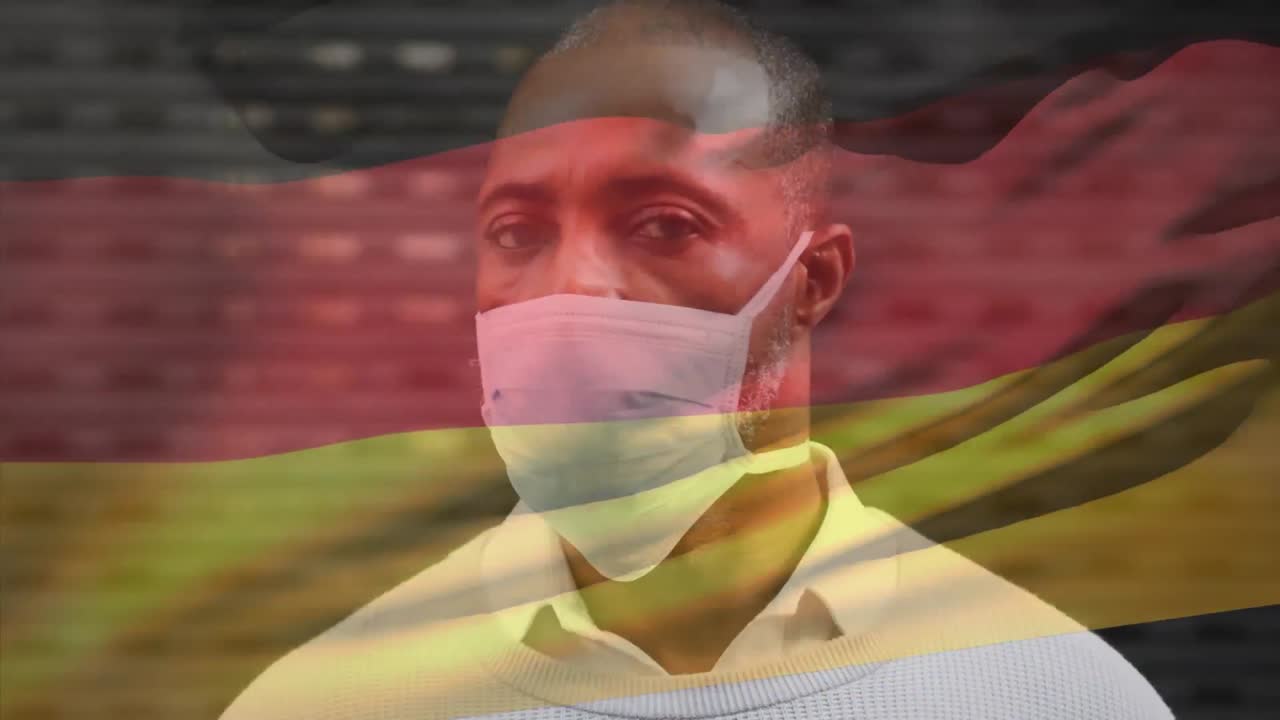 코로나 19 대유행 기간 동안 얼굴 마스크를 쓴 남자가 독일 국기를 흔들고 있는 애니메이션