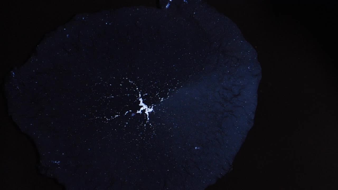 Intense gravity from a black hole draws in a multitude of stars and celestial vapors, talking drama here   -  For more, search  "AbstractVideoClip" using the quotation marks