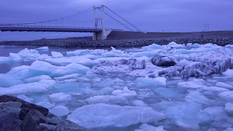 icebergs flow down a glacial river suggest global warming in the arctic at jokulsarlon glacier lagoon iceland night