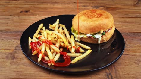 Detailed-close-up-of-a-funghi-burger-accompanied-by-French-fries-being-doused-with-ketchup