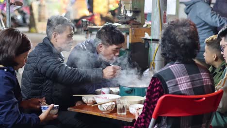 family dining at a street food stall