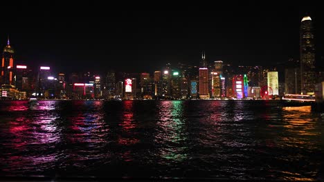 colorful skyline reflections on water at night