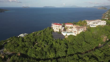 huge estate on island hilltop under construction with solar and pools