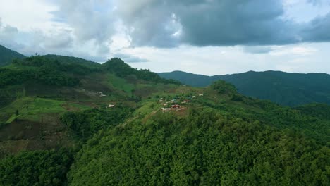 4K-Cinematic-nature-aerial-footage-of-a-drone-flying-over-the-beautiful-mountains-of-Chiang-Mai,-Thailand-on-a-sunny-day