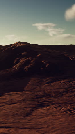 a beautiful desert landscape with a mountain range in the distance