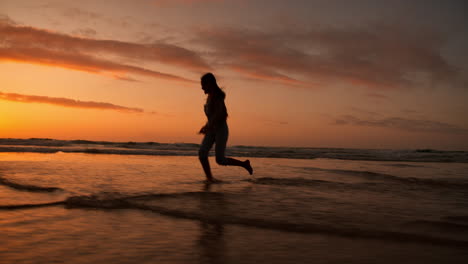 girl kid, silhouette and sunset by ocean