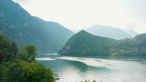 Aerial-View-Of-Lake-Perucac-At-The-Foot-Of-The-Beautiful-Mountain-Tara-In-Serbia---aerial-drone-shot