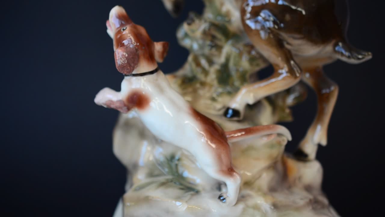 Shooting of a figurine of a dog. Shooting of a figurine