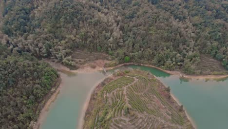 An-island-in-the-middle-of-a-lake,-and-also-a-mountain-of-tea-field