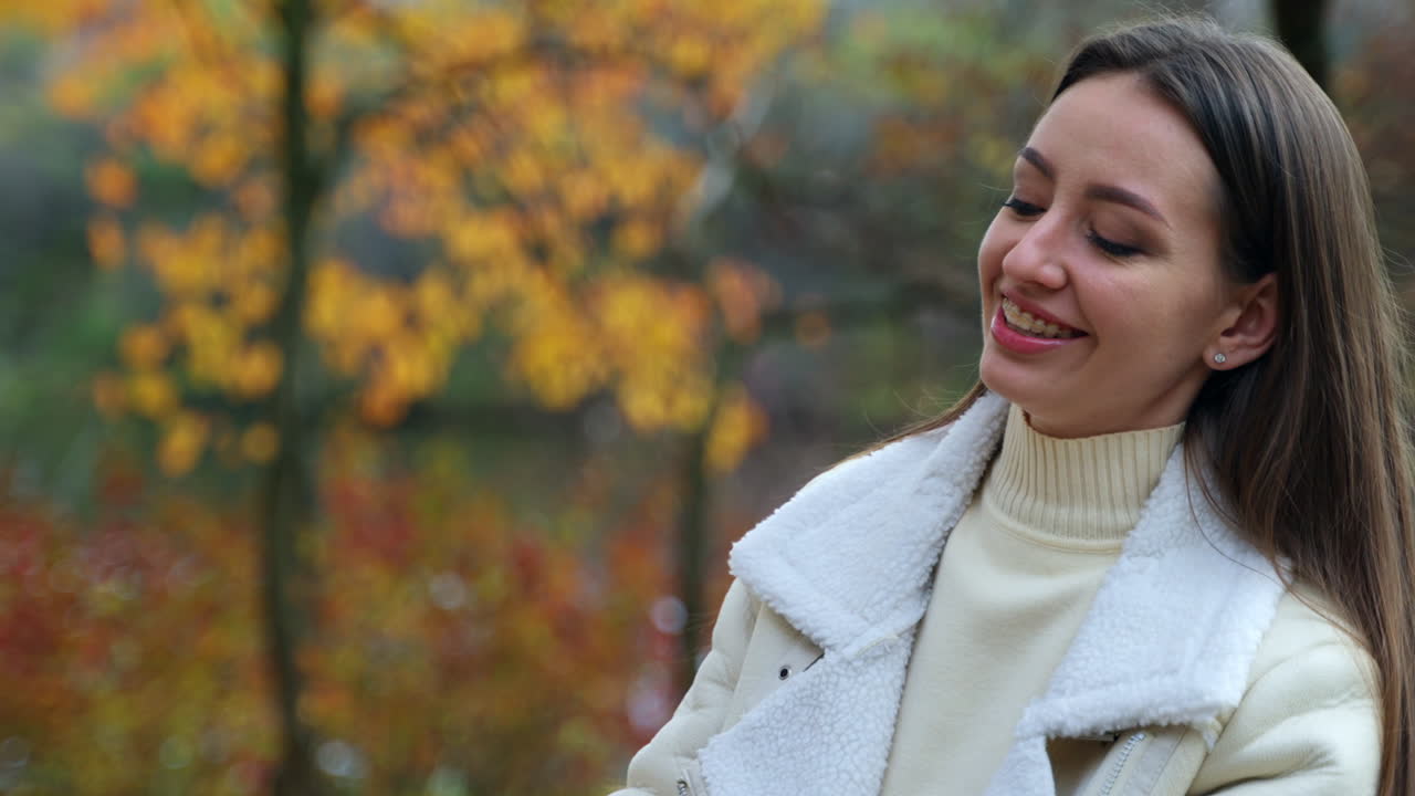 Woman Smiling in Autumn Park