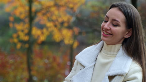 woman smiling in autumn park