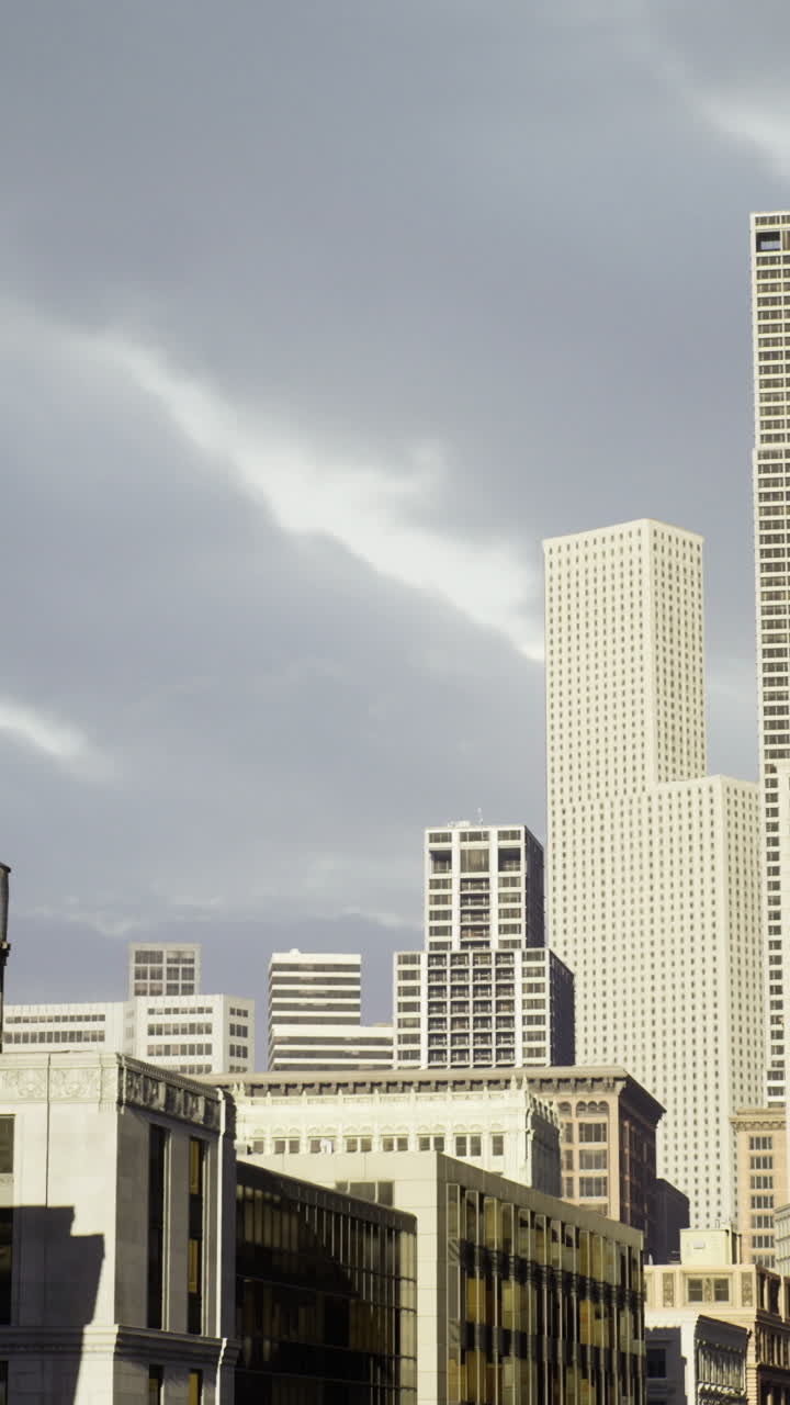 Urban skyline captures dynamic city life under cloudy skies