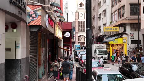 pedestrians and vehicles in bustling urban environment